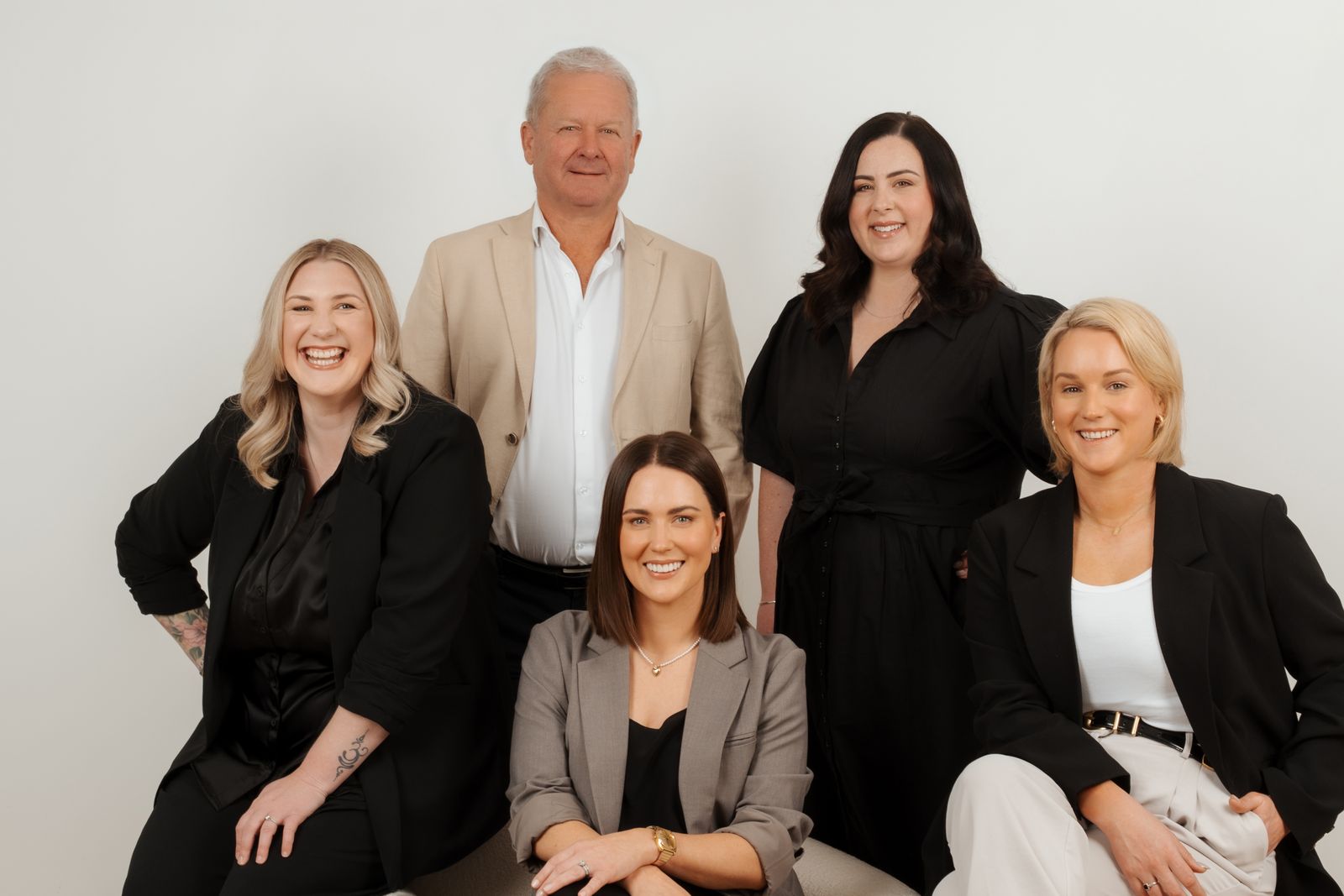The Story Group team: five advisers and support staff together in the studio